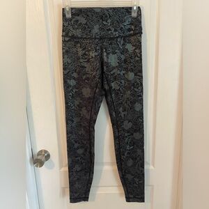 Lululemon size 6 wunder under leggings, black with holographic print.